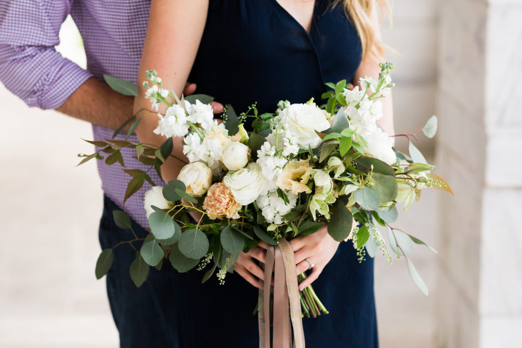Questions to ask your wedding photographer | navy blue engagement dress with neutral wedding bouquet