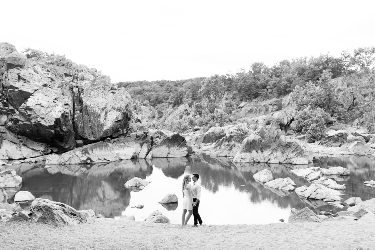 Couple posing at private beach at Great Falls