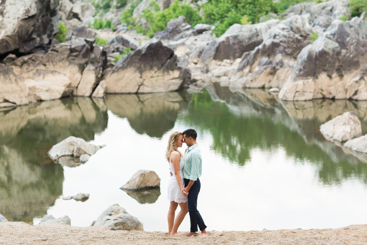 Couple posing against private beach at Great Falls