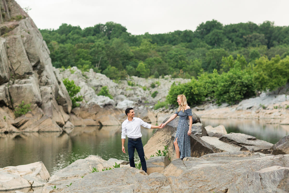 Couple posing on rocks at Great Falls during engagement session