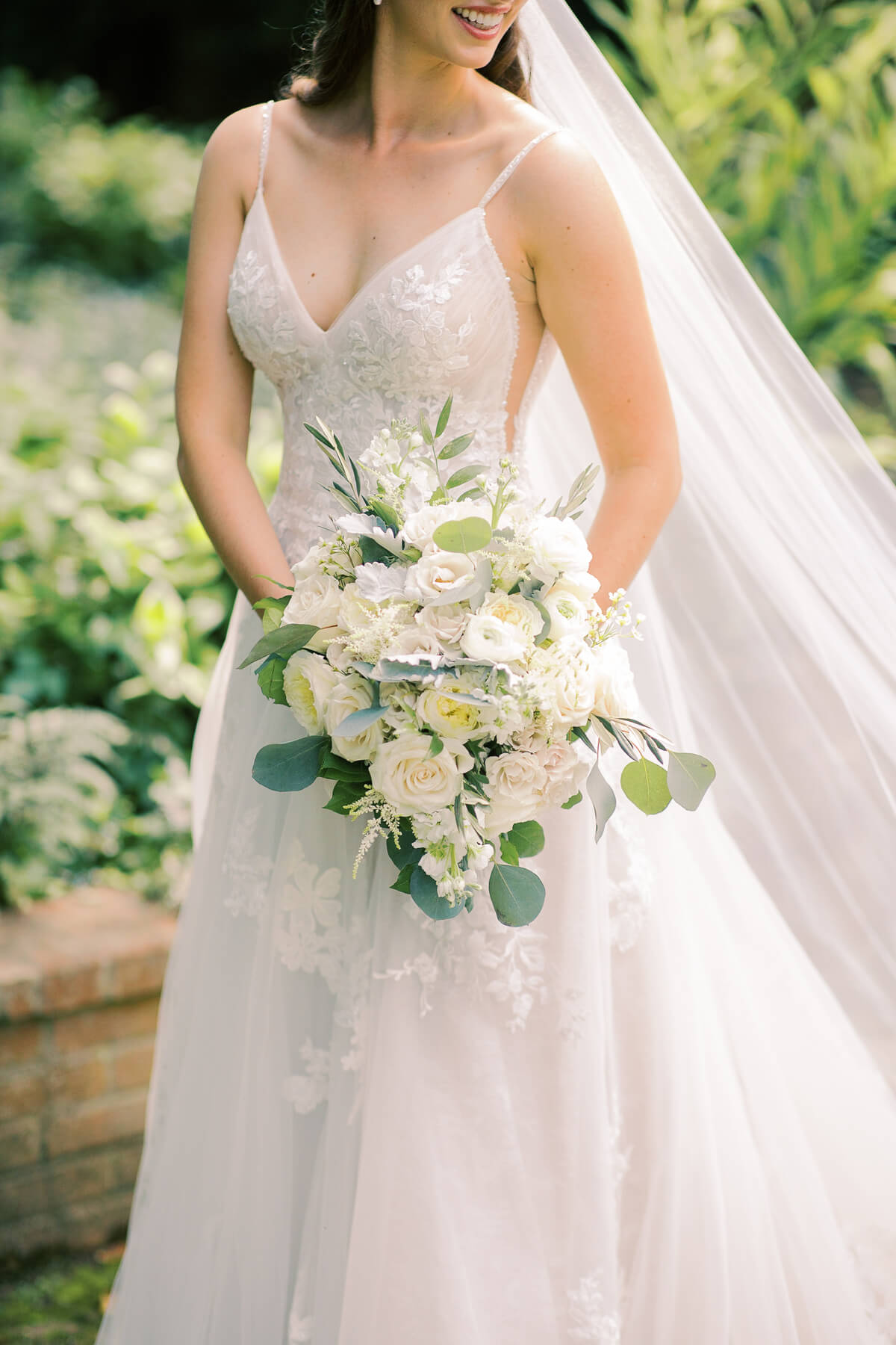 White roses and greenery wedding bouquet